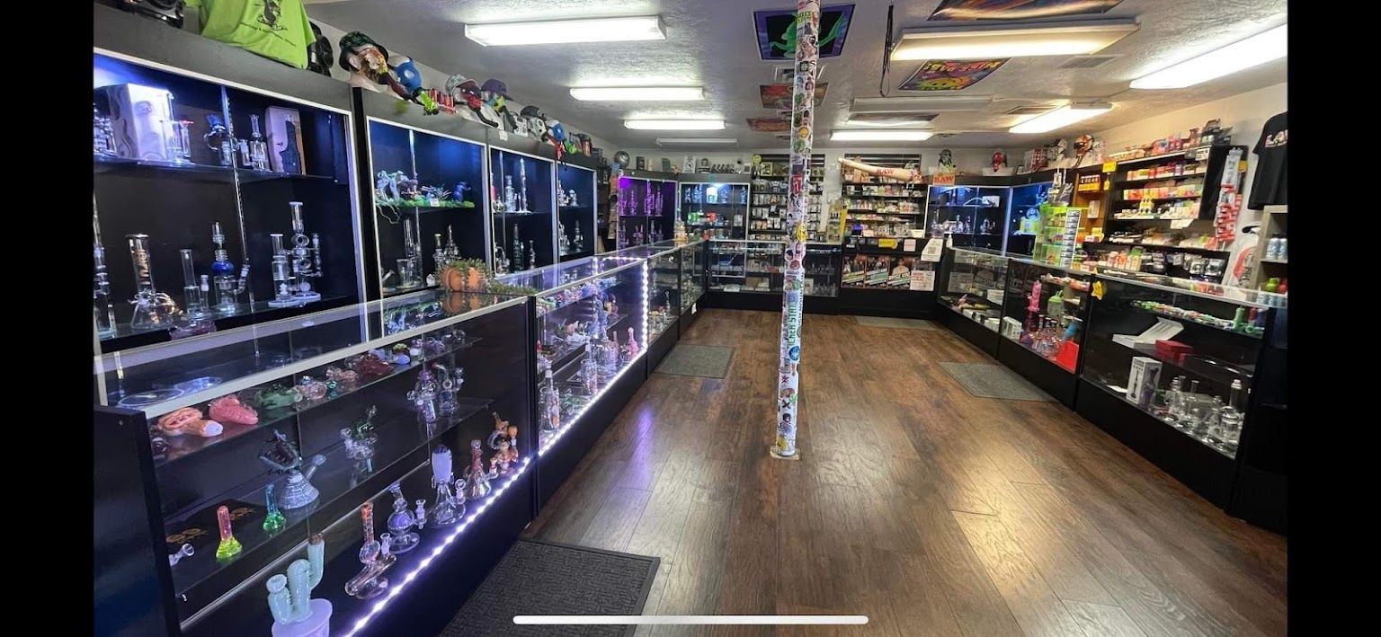 The inside of a smoke shop filled with lots of glass pipes.