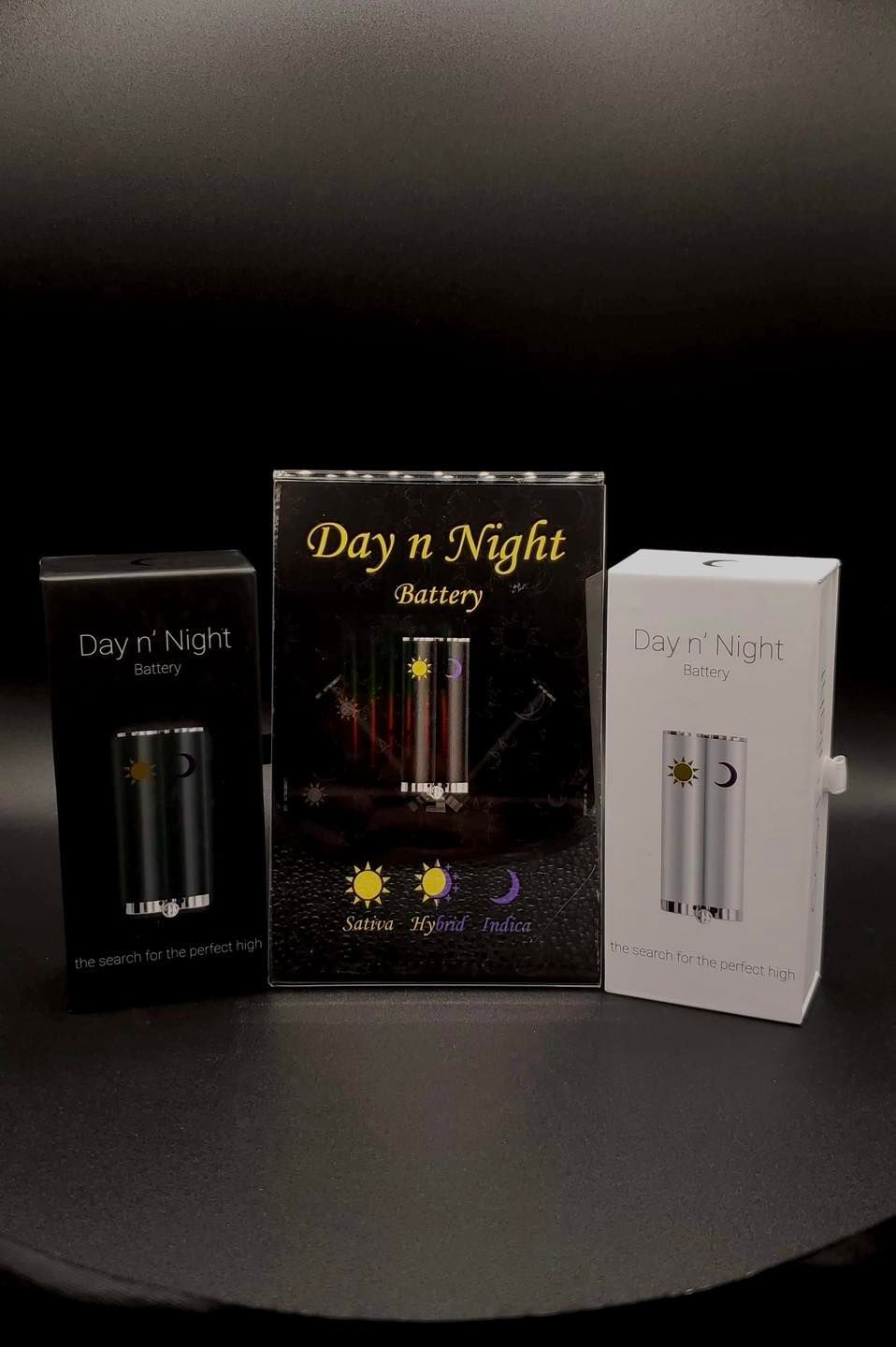 Three boxes of electronic cigarettes are sitting on a table.