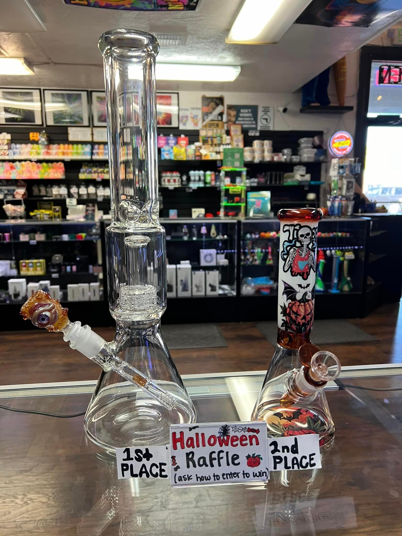 Two glass bongs are sitting on a table in a store.