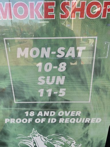 A sign that says smoke shop mon-sat 10-8 sun 11-5