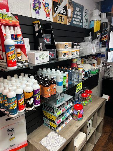 A store filled with lots of bottles of liquid and candy.
