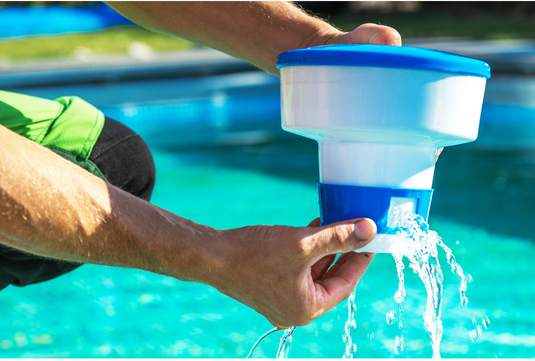 A picture of a man holding a pool filter over a pool with water coming out of it in LaPlace, LA.
