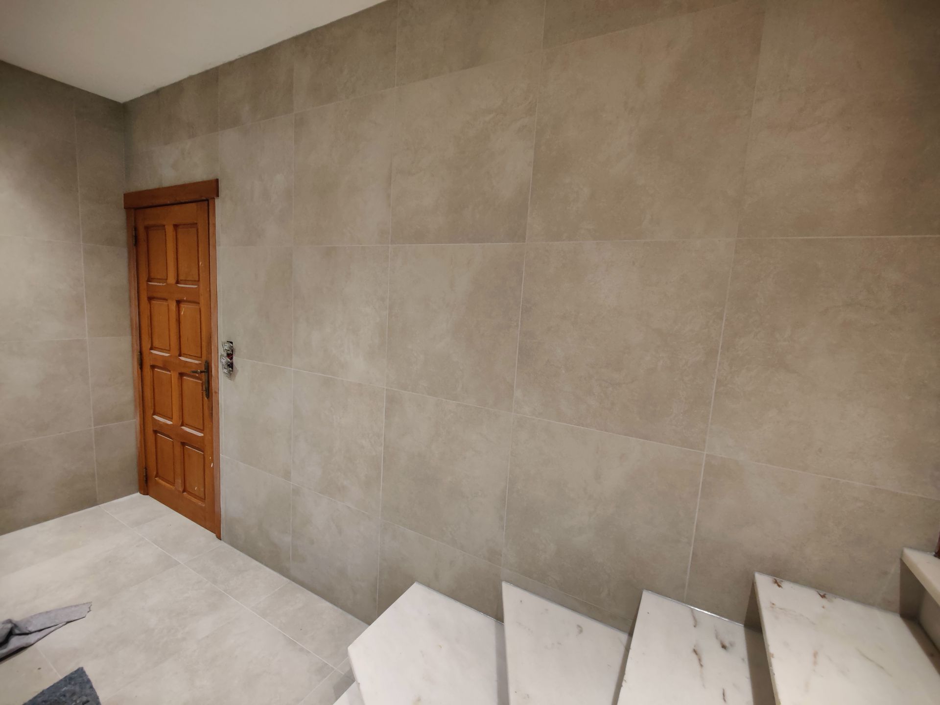 A room with a door and stairs in it