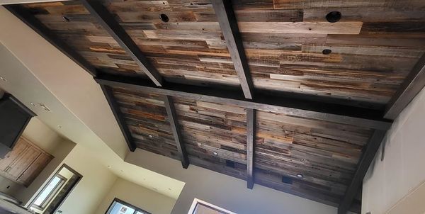 Rustic wooden ceiling with dark beams.