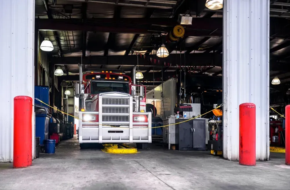 Red Semi-truck Inside a Garage With Open Doors — Advanced Auto Electrics & Mechanical in Babinda, QLD
