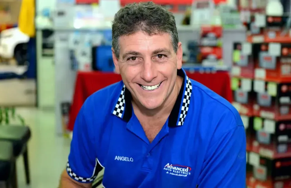 A Smiling Person in a Blue Checkered-collar Polo Shirt — Advanced Auto Electrics & Mechanical in Innisfail, QLD