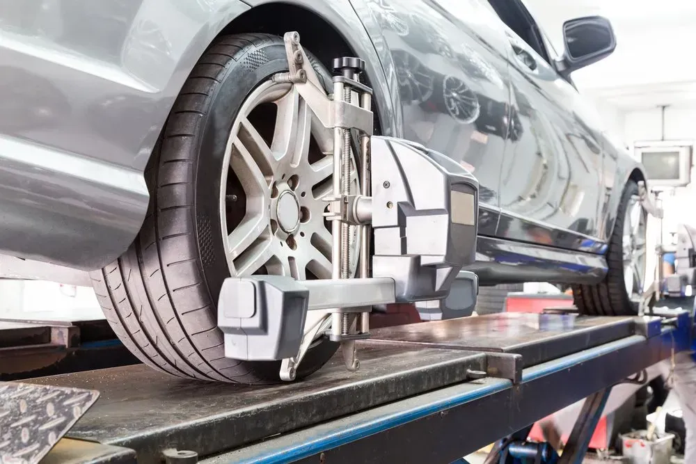 Car on a Lift Undergoing a Wheel Alignment Check — Advanced Auto Electrics & Mechanical in Innisfail, QLD
