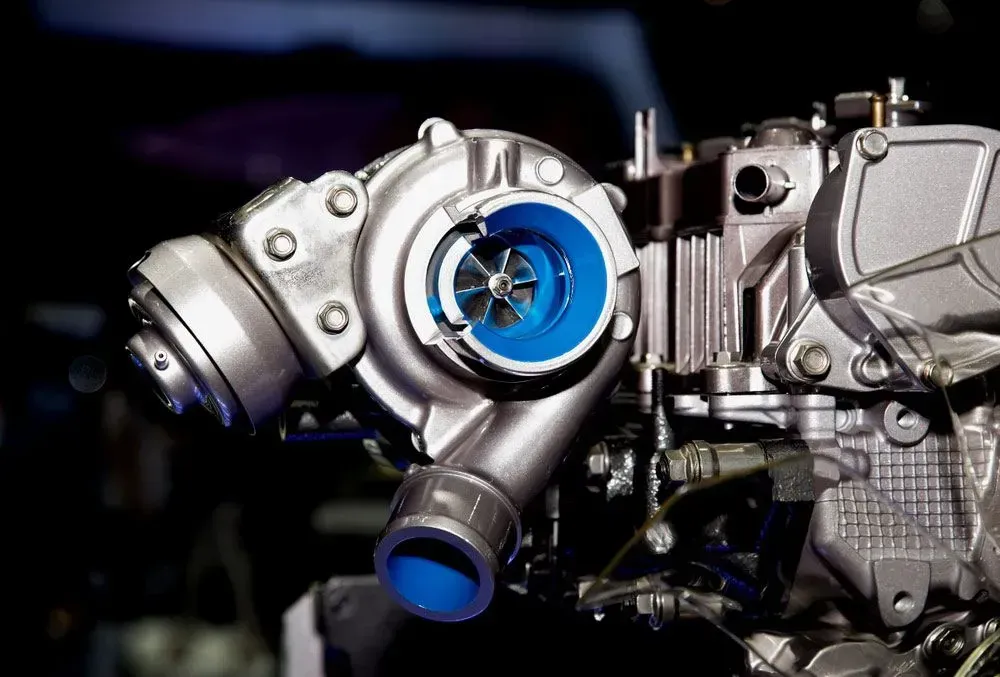 Close-up of a Silver Car Turbocharger With Blue Accents — Advanced Auto Electrics & Mechanical in Innisfail, QLD