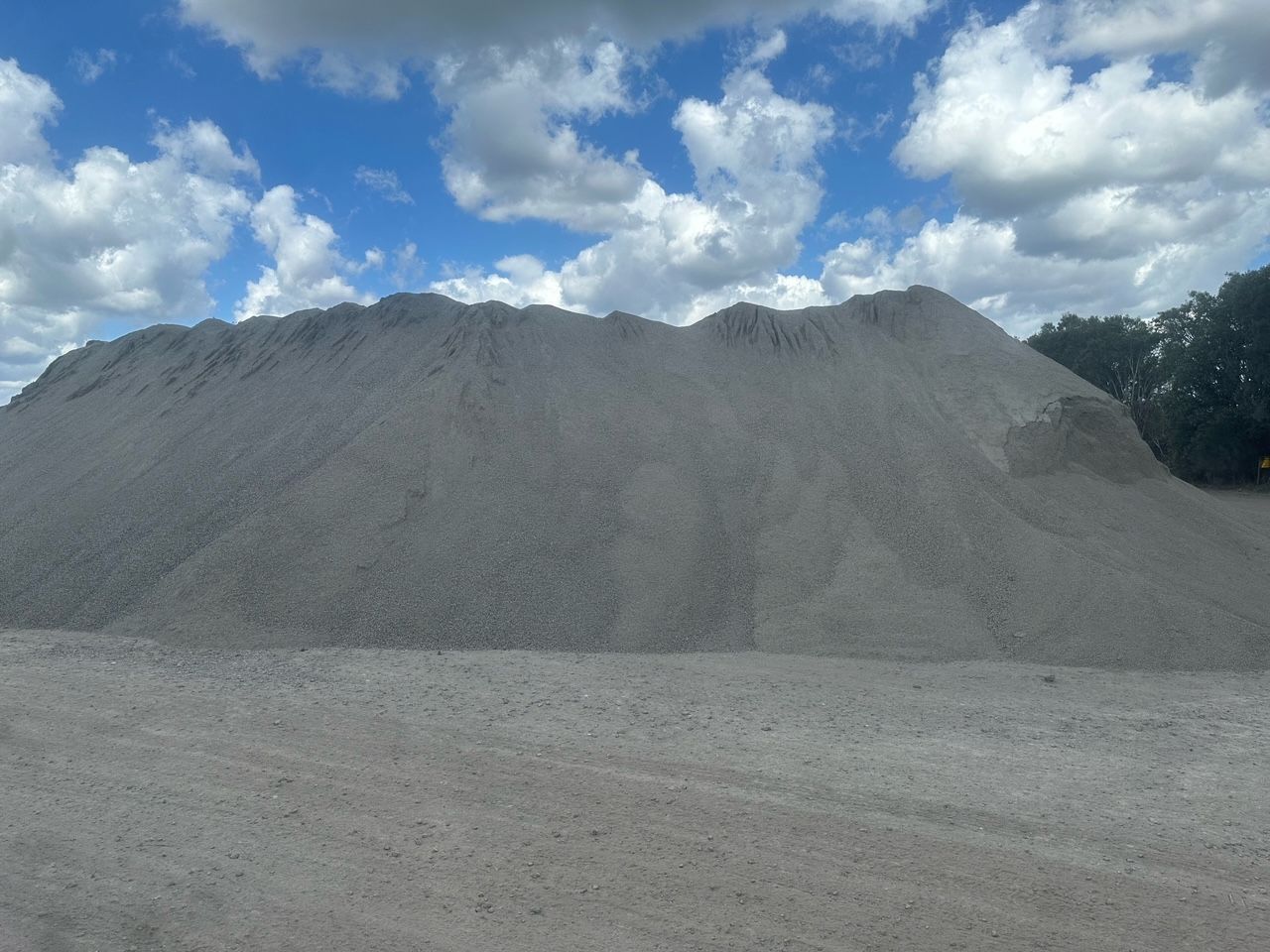 Large Gray Gravel Pile in an Open Yard — Envy Landscape Supplies In Urangan, QLD
