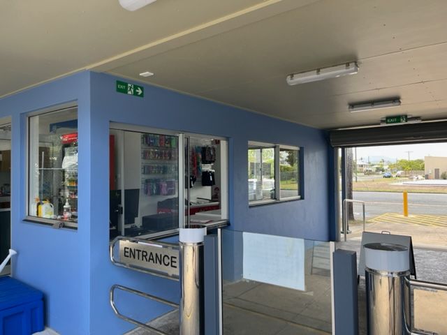 An entrance to a building with a blue wall — Red Emperor Constructions in Cannonvale, QLD