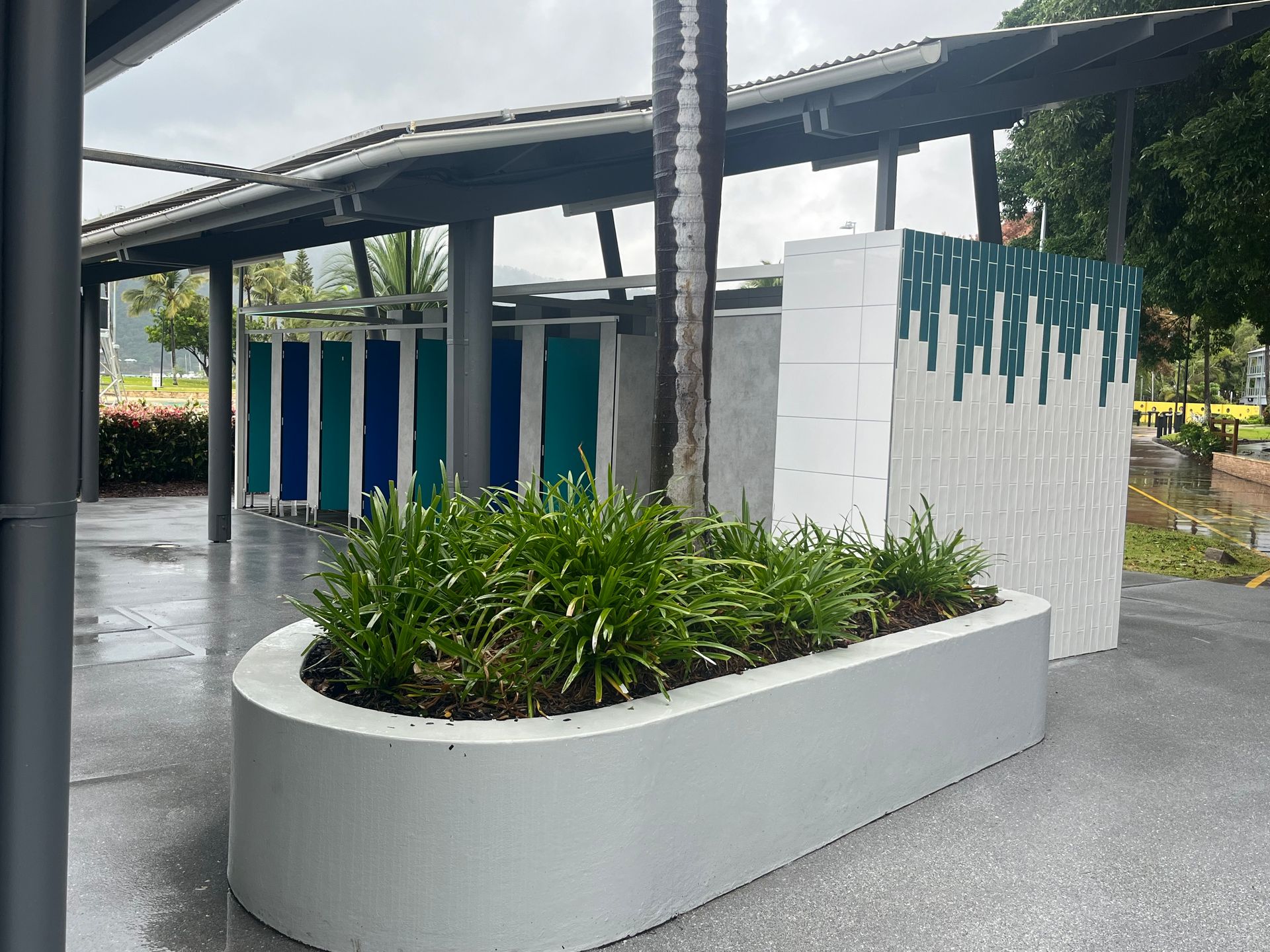 Outdoor Public Restrooms With a Concrete Planter in Front — Red Emperor Constructions in Cannonvale, QLD