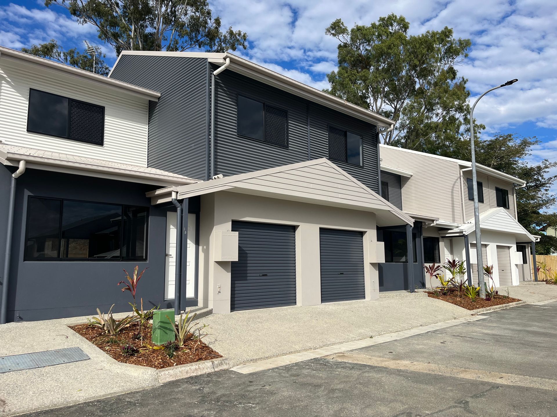 Modern Townhouses With Gray and White Exteriors, Two-car Garages — Red Emperor Constructions in Cannonvale, QLD