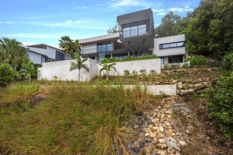 Modern Multi-story House on a Hillside, With Grey and White Exterior — Red Emperor Constructions in Cannonvale, QLD