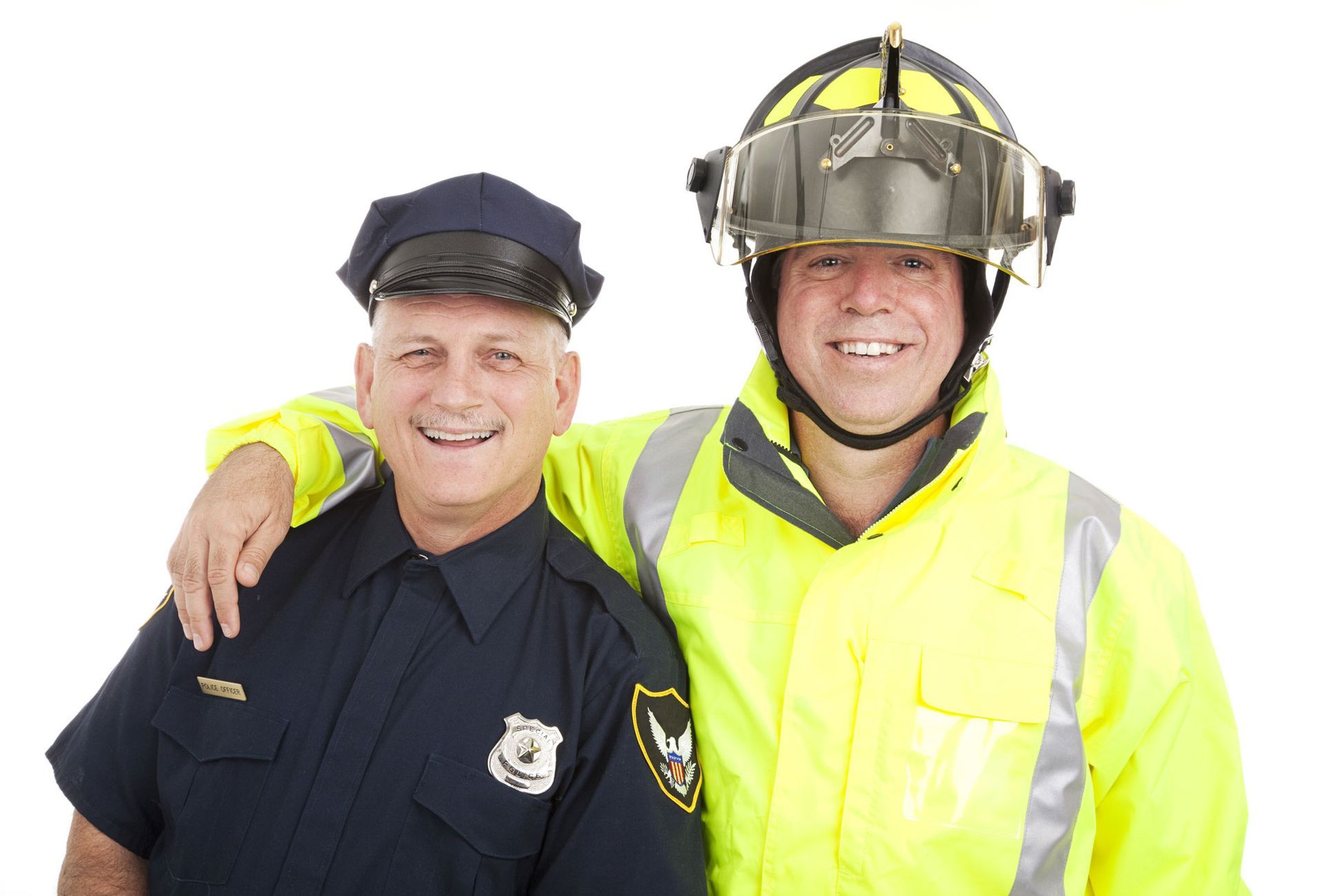 A police officer and a fireman are posing for a picture together.
