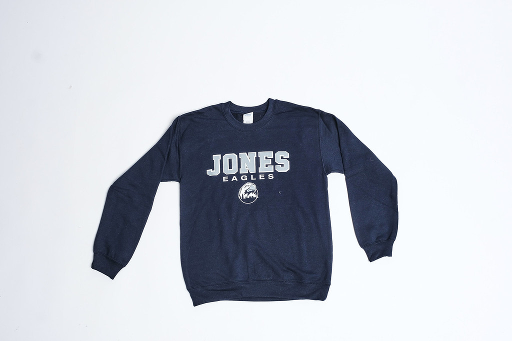 Navy blue long-sleeve sweatshirt with “JONES” printed in white on the front, laid flat on a white background
