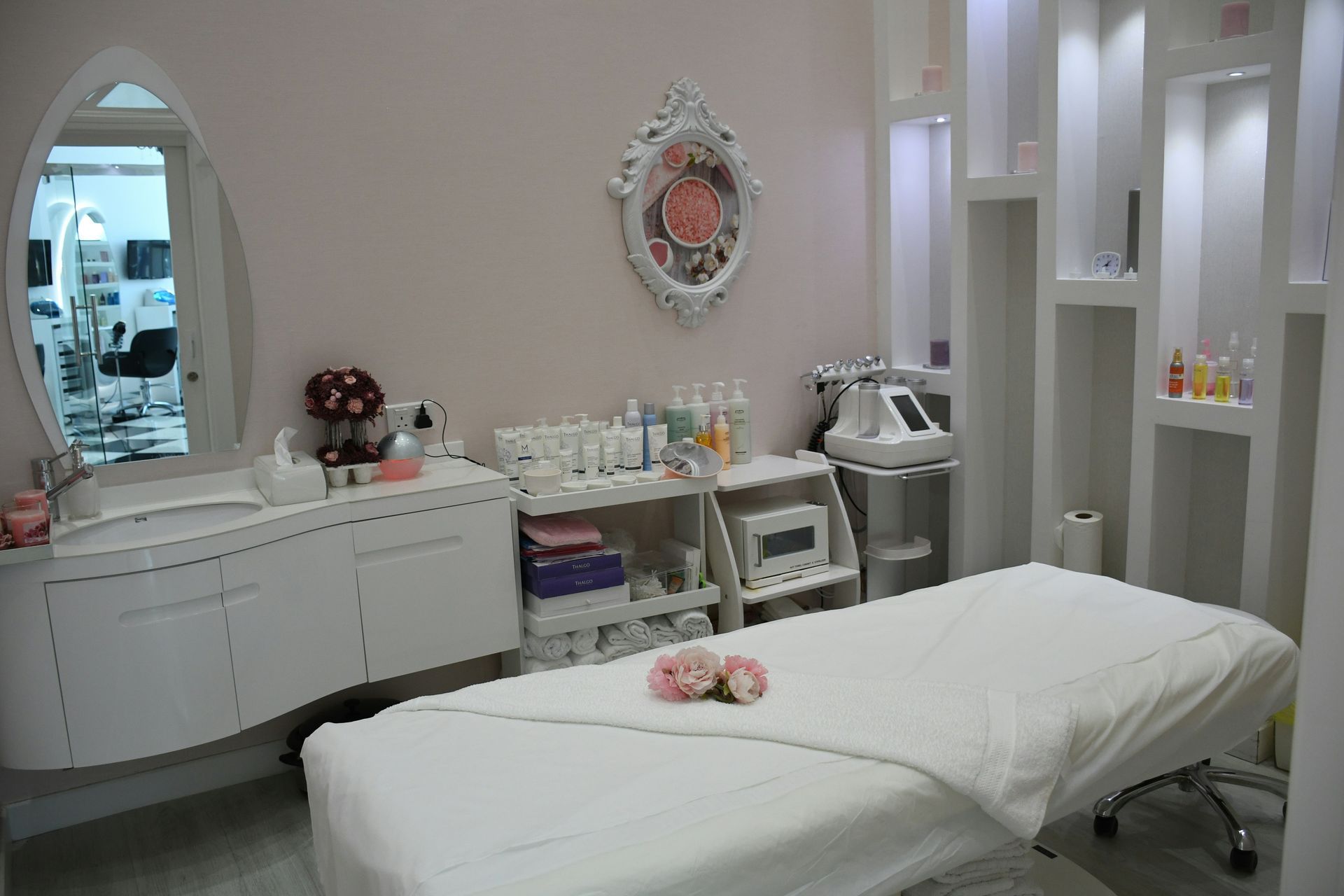 There is a massage table in the middle of the room.