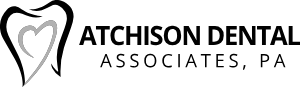 Logo for Atchison Dental Associates, PA. A tooth shape with a heart inside it and the name of the practice.