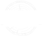 Faint circular decorative emblem with engraved text around the edge on a white background