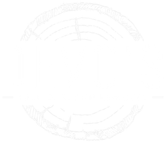 Faint circular decorative emblem with engraved text around the edge on a white background