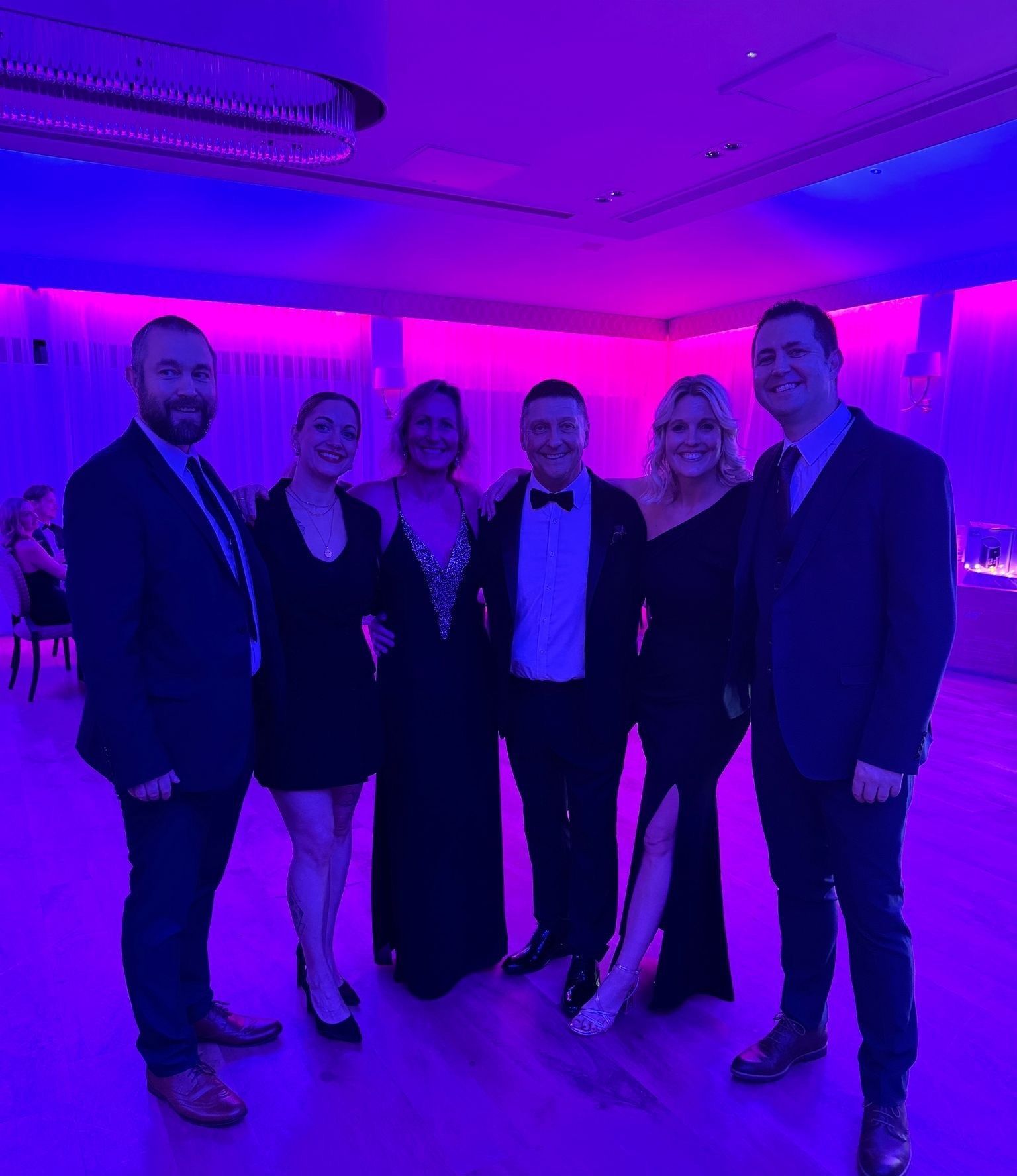 Steve and family from Buzz Electrical pose for photo at the Charity Ball