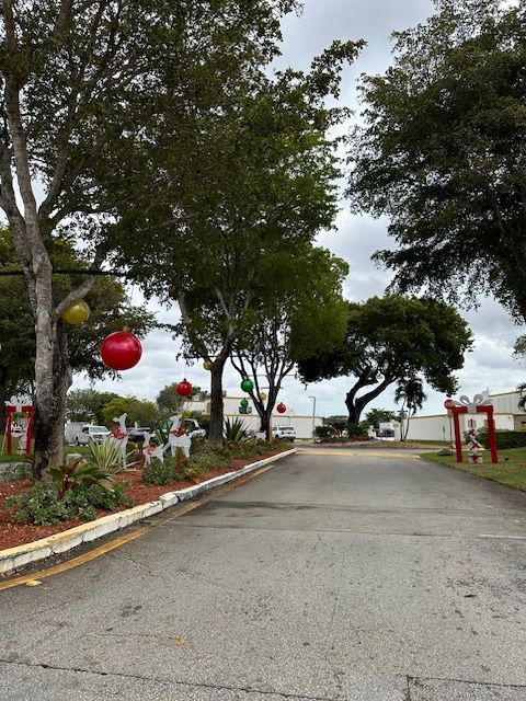 a road with christmas decorations on the side of it