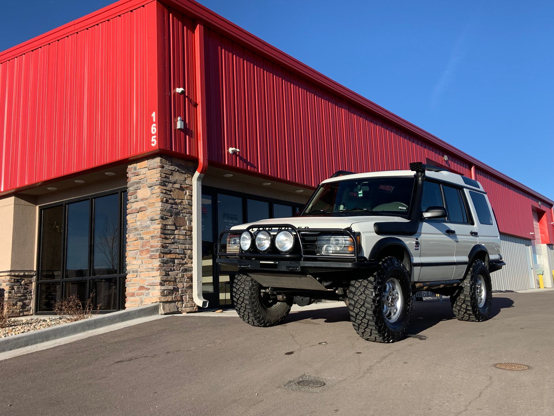 White Land Rover Discovery SUV | Peak European