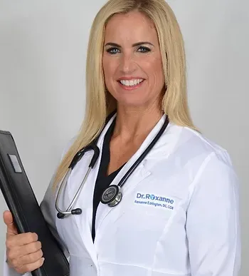 a woman in a lab coat with a stethoscope around her neck is holding a clipboard .