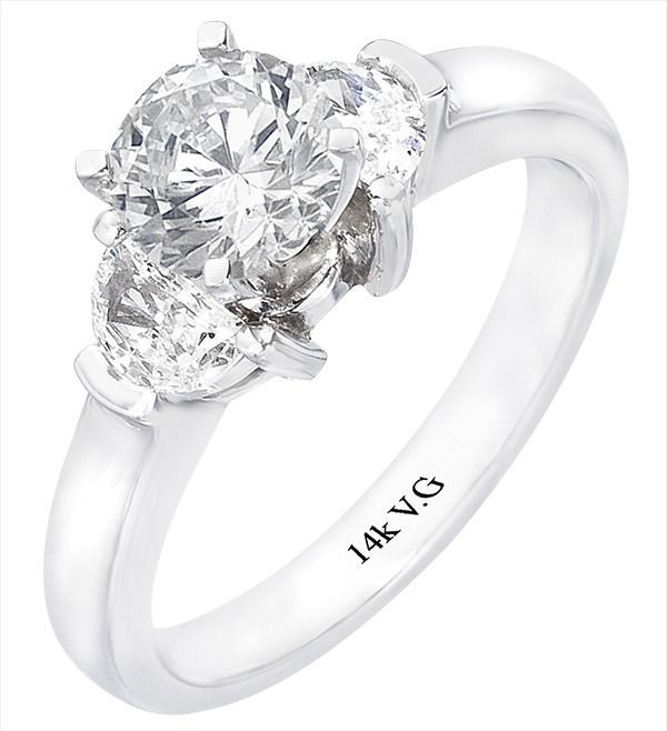 A white gold ring with a heart shaped diamond in the center