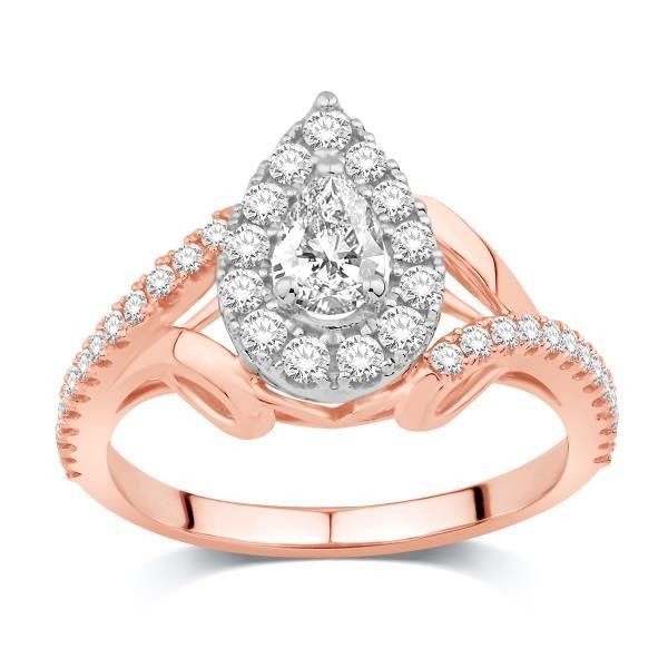 A rose gold ring with a pear shaped diamond in the center