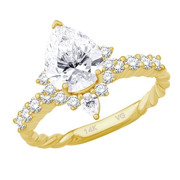 A yellow gold ring with a pear shaped diamond in the center