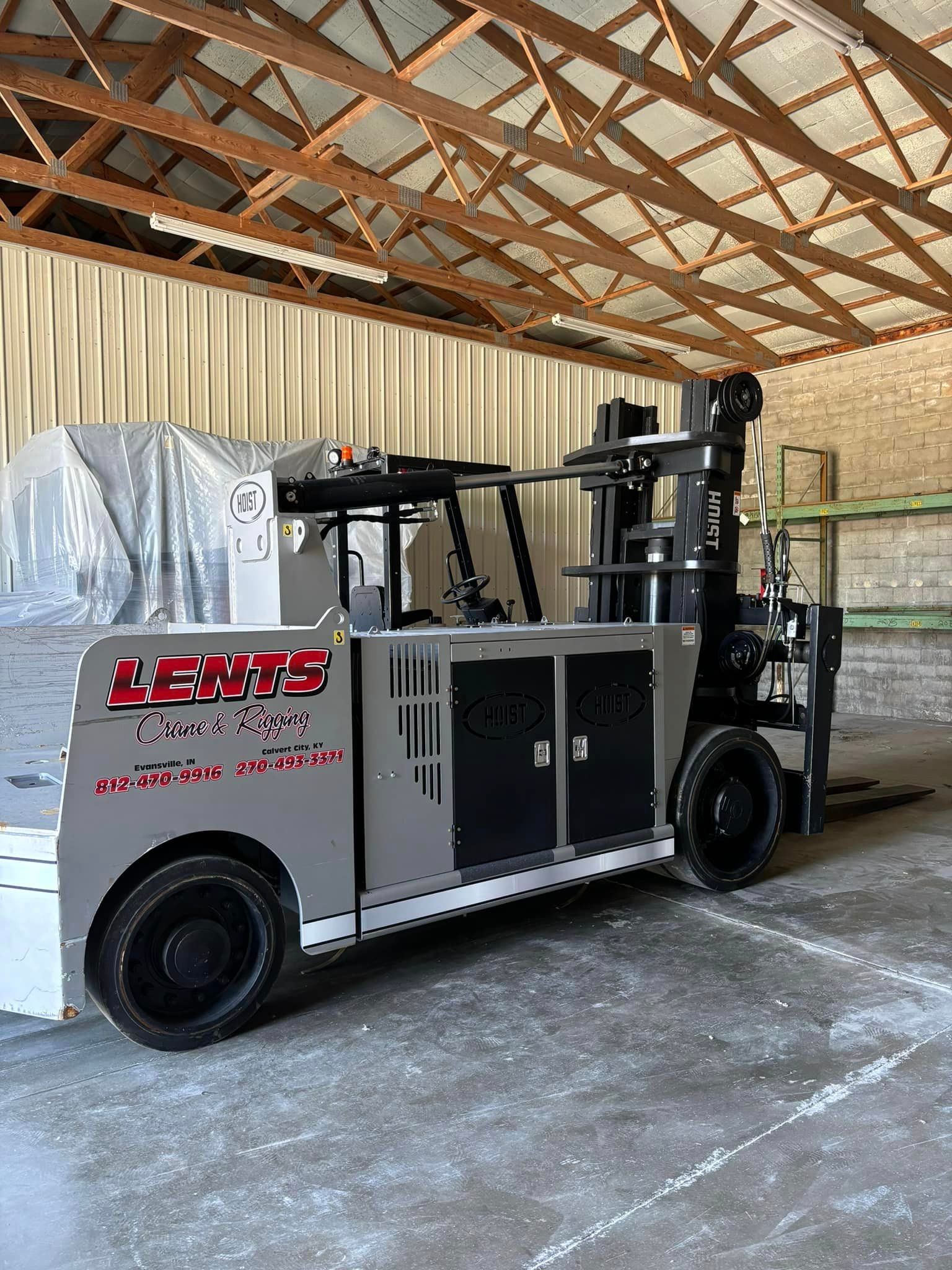 A forklift is parked in a warehouse.