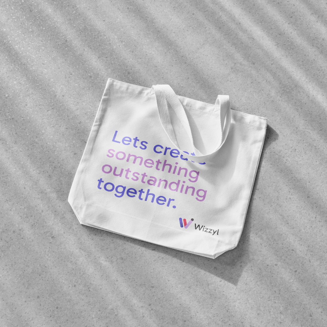 A white tote bag with the words `` lets create something outstanding together '' written on it.