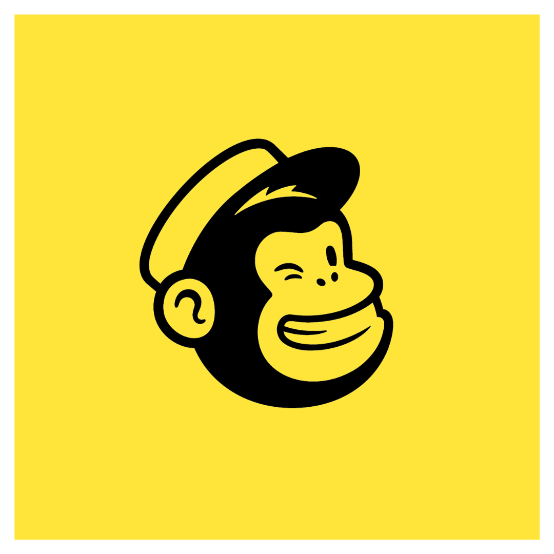 A monkey wearing a hat is smiling on a yellow background.