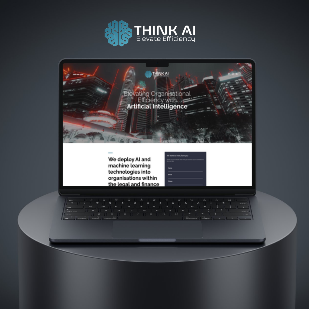 A laptop computer is sitting on top of a round table.