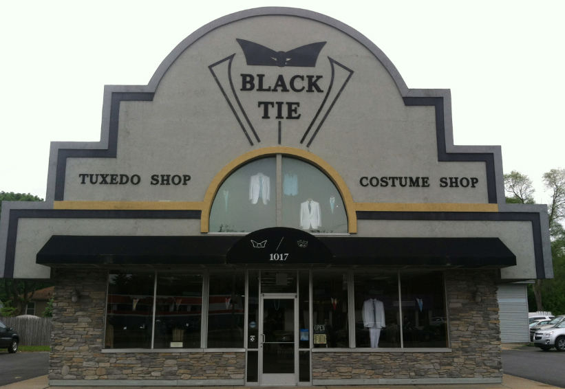 A black tie tuxedo shop and costume shop.