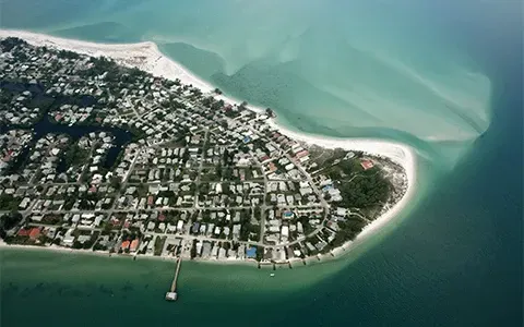 An aerial view of a small island in the middle of the ocean
