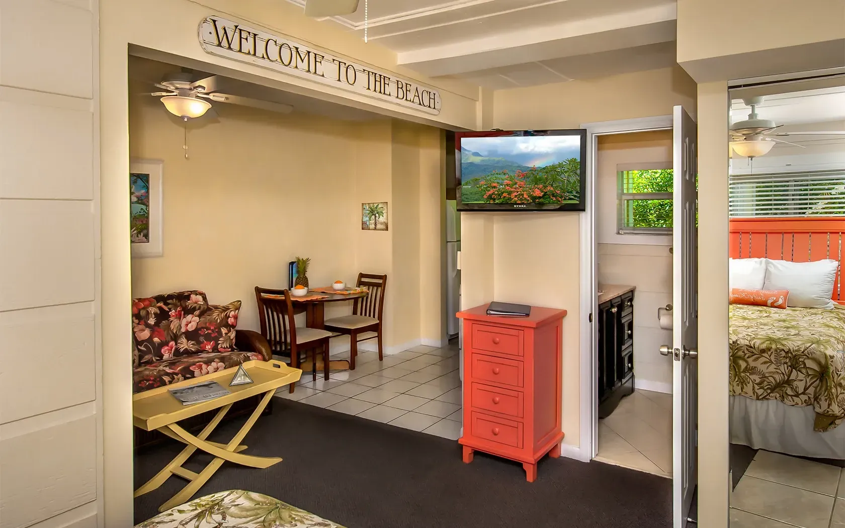 A living room with a sign that says welcome to the bay