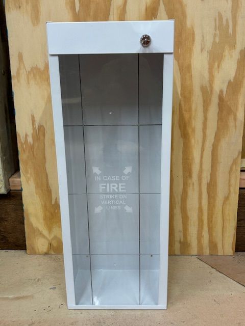White metal fire extinguisher cabinet with glass front, lock, and 