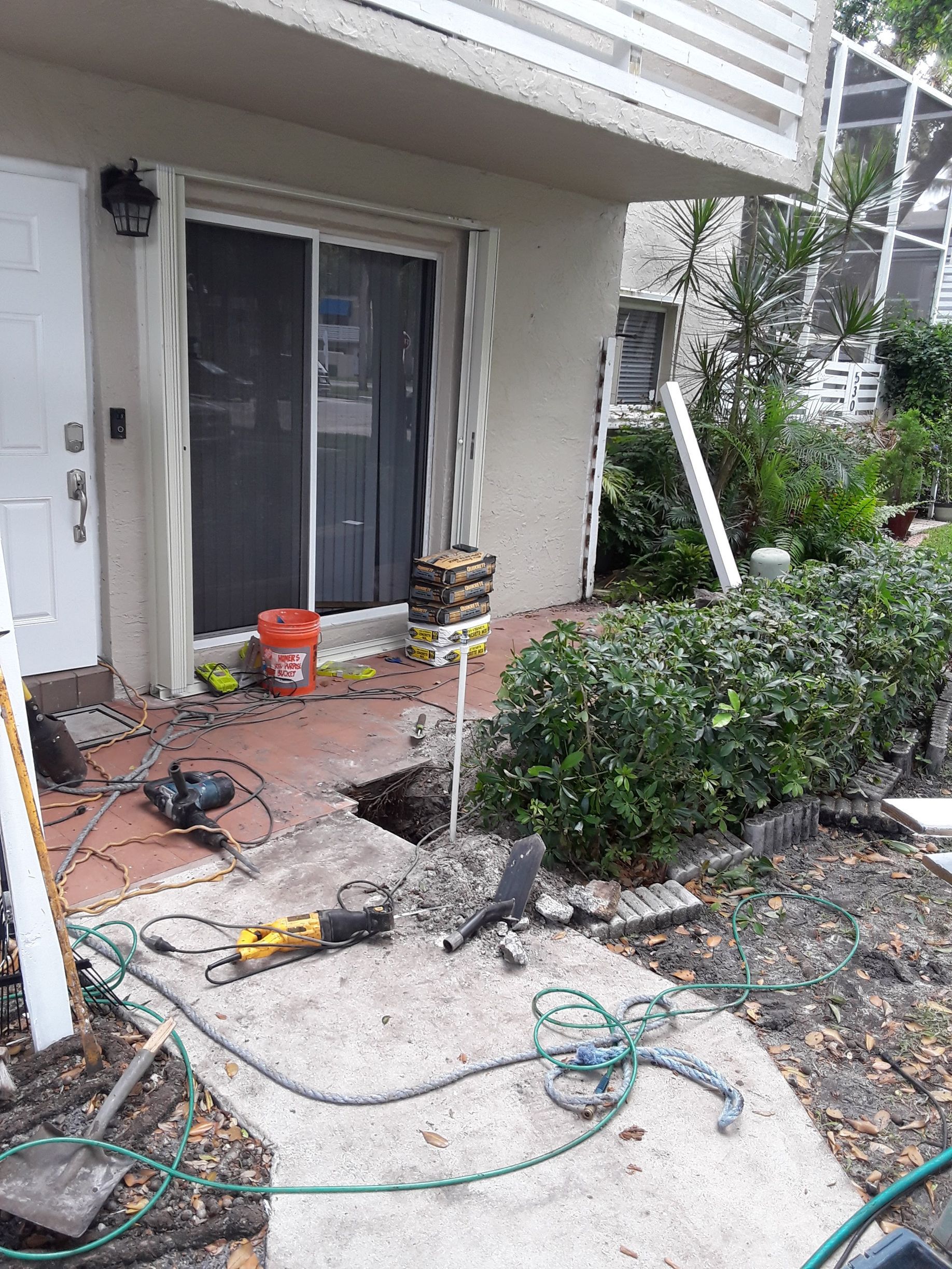 A house with a sliding glass door is being remodeled.