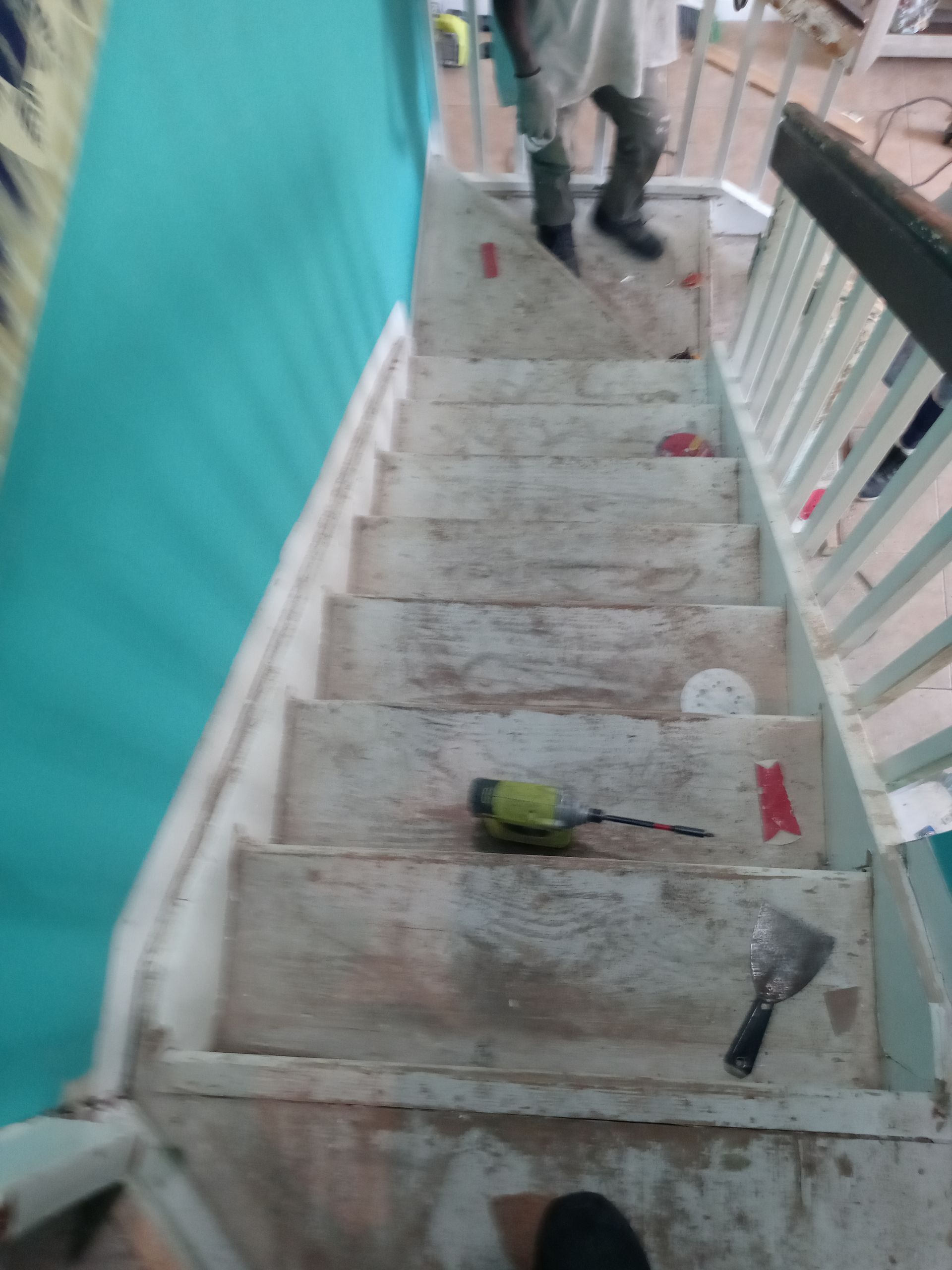 A person is standing on a set of stairs.