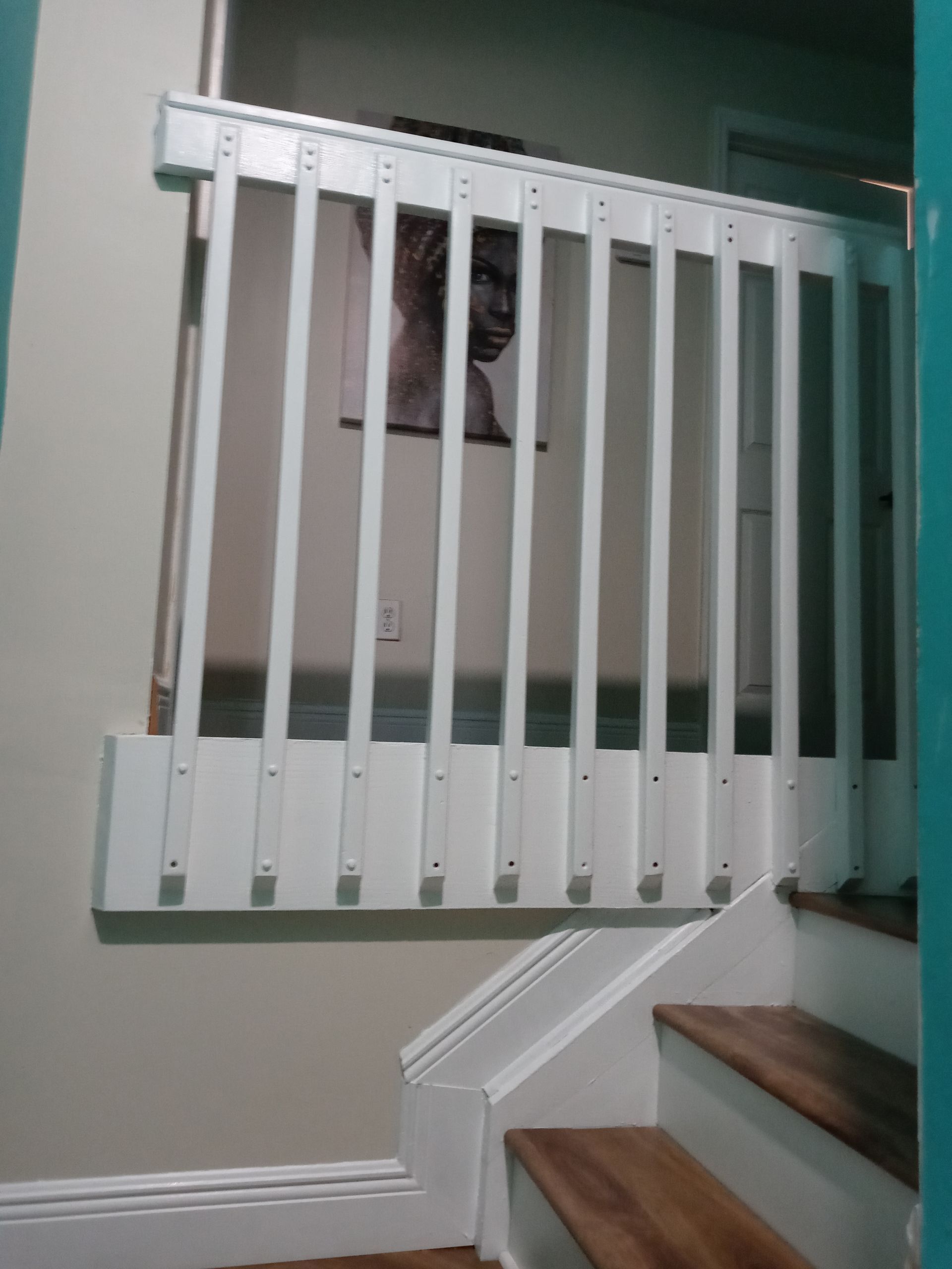A staircase with a white railing and wooden steps