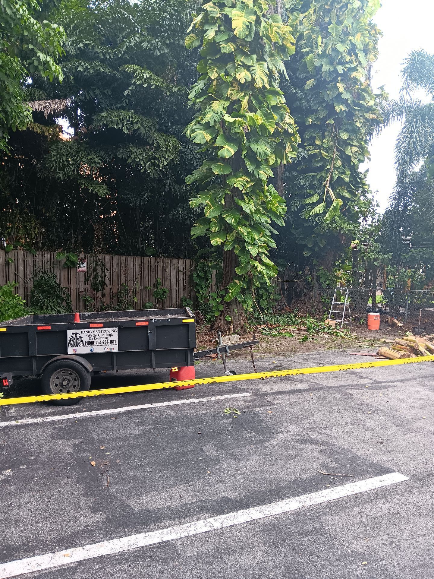 A dumpster is parked on the side of the road.