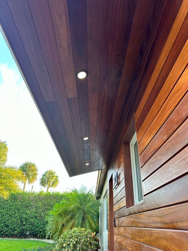 A house with wooden siding and a wooden ceiling.