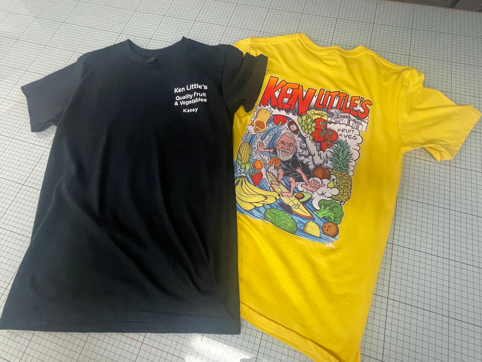 Two t-shirts: black with white text and yellow with a colorful graphic. — Carbon Copy Digital in Port Macquarie, NSW