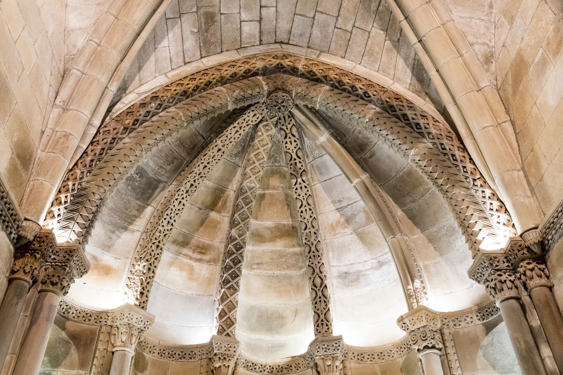 A church with a dome shaped ceiling and columns
