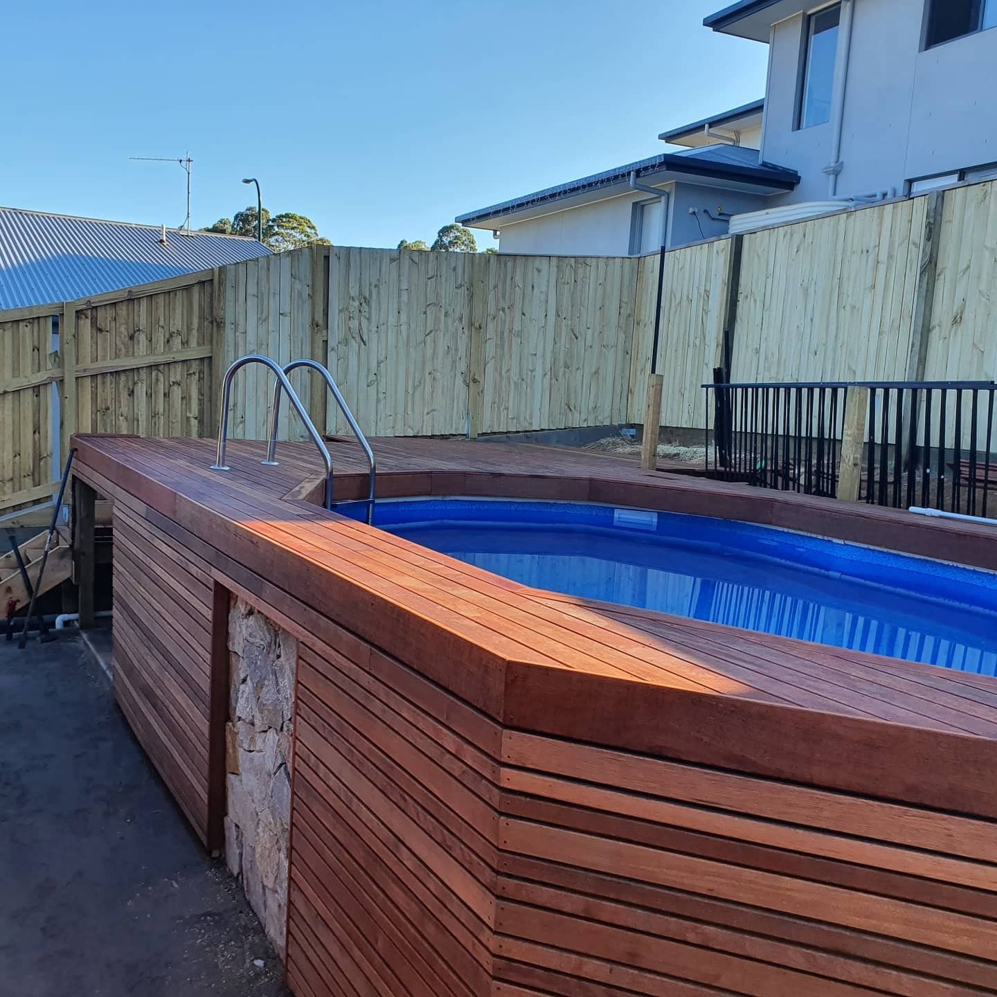 Wooden Deck Built Around Pool — Red Dog Landscaping in Banora Point, NSW