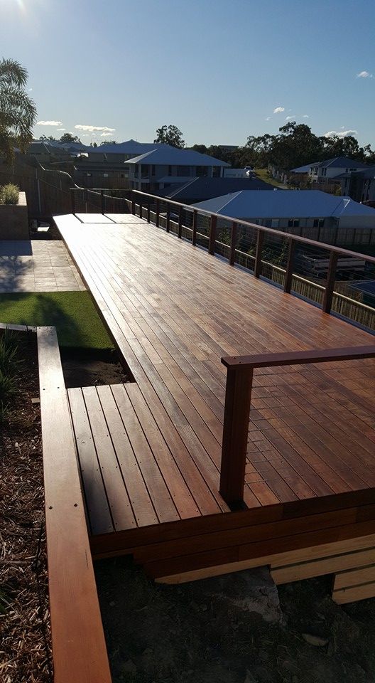 Timber Stained Deck With Hand Rail — Red Dog Landscaping in Tweed Heads, NSW
