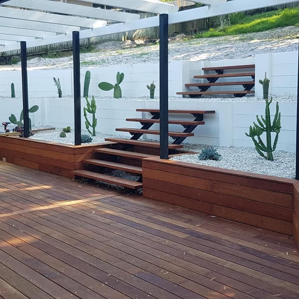 Timber Decking At The Bottom Of Stairs — Red Dog Landscaping in Banora Point, NSW