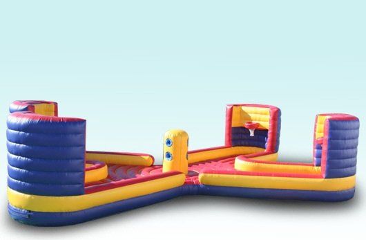 happy excited boy having fun on inflatable attraction playground