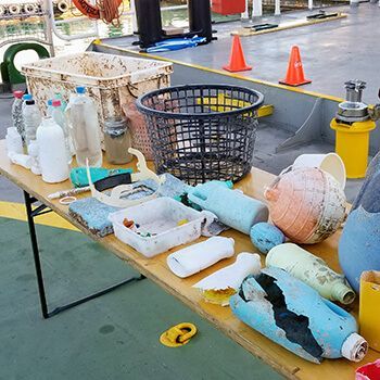 A table filled with lots of plastic bottles and containers.